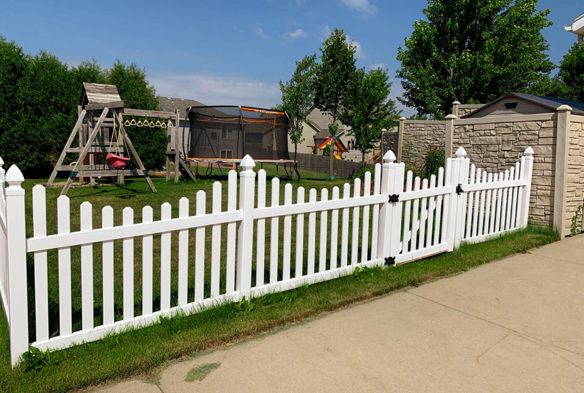 Beautiful white picket fence with decorative caps enhancing residential curb appeal in Hacienda Heights, CA
